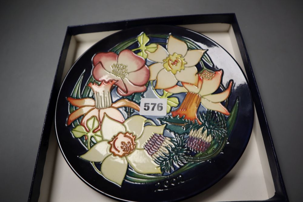 A Moorcroft 2000 year plate, Birth of Light, designed by Nicola Slaney and Wendy Mason, limited edition number 368 of 2000, 23cms d
